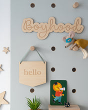 Load image into Gallery viewer, wooden boyhood wall sign on a blue peg board