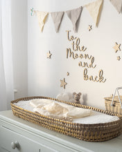 Load image into Gallery viewer, Wooden 'to the moon and back' nursery wall art sign on a white wall above a baby changing table, surrounded by wooden stars and neutral decor