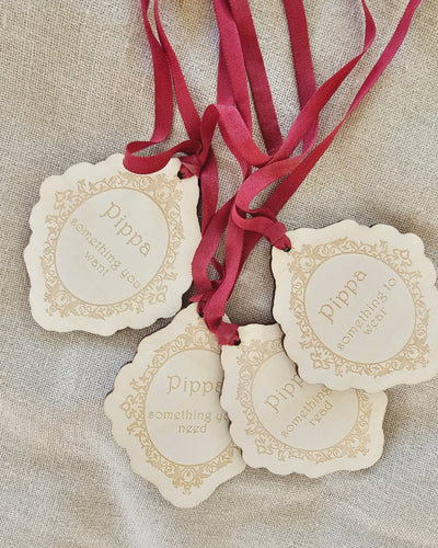 Personalised Wooden Christmas gift tags on red ribbon