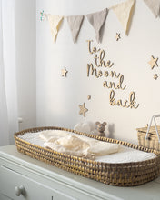 Load image into Gallery viewer, Wooden &#39;to the moon and back&#39; nursery wall art sign on a white wall above a baby changing table, surrounded by wooden stars and neutral decor
