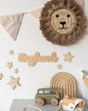 Load image into Gallery viewer, boyhood wood wall sign on a white wall surrounded by stars and a raffia lion head
